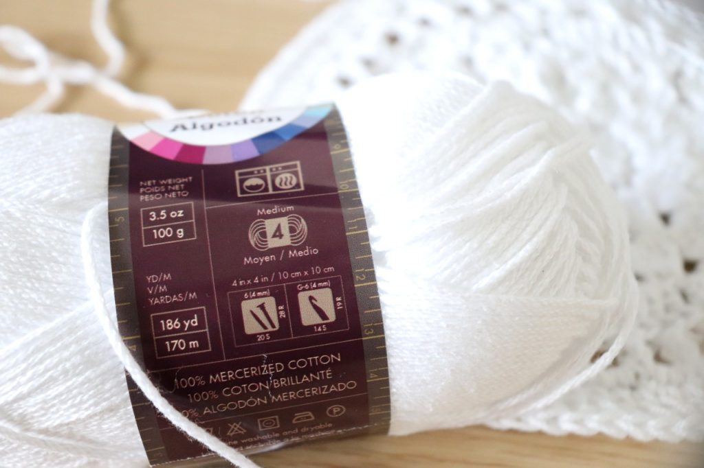 A photo showing all of the important information you will find on a yarn label. Sigoni is explaining how gauge relates to improving your yarn tension in crochet - via her latest blog post, 7 Constructive Tips to Improve Your Yarn Tension