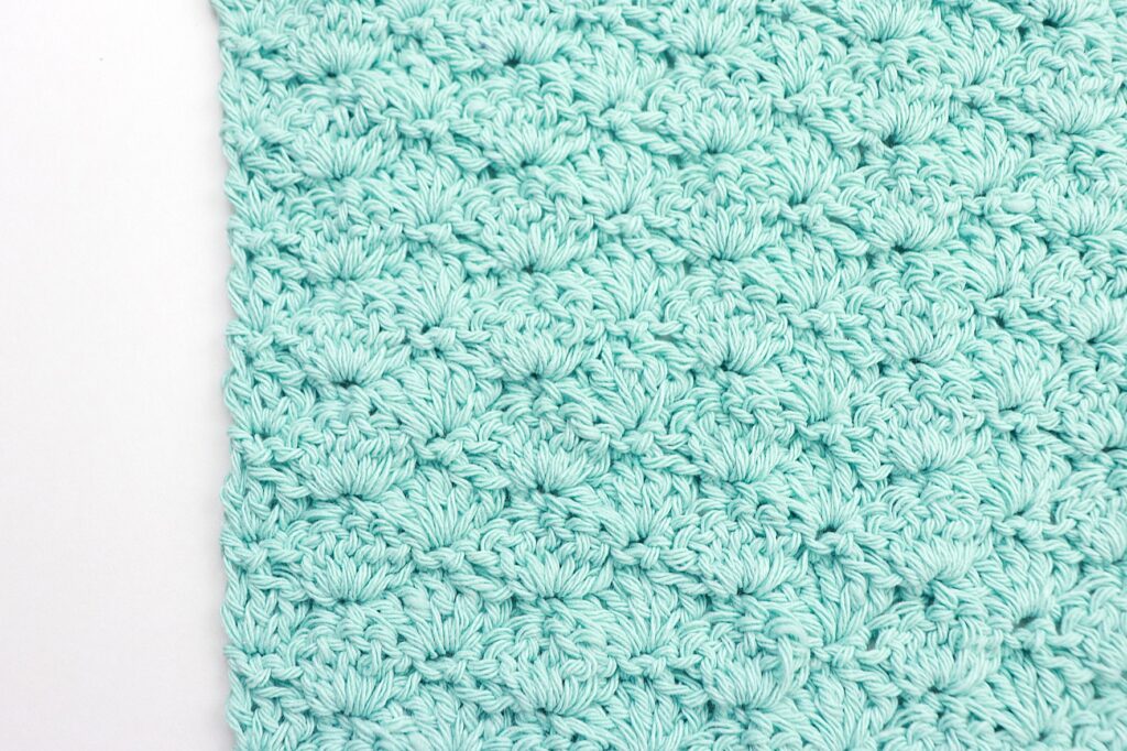 Double crochet shell stitch crochet washcloth up close
