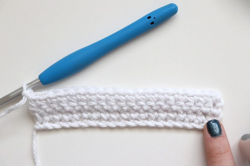 Rows 1-3 of the Basic Shell Stitch Washcloth Crochet Pattern for Beginners - tutorial photo