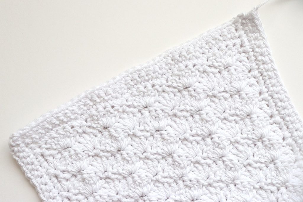 The finished design of the Basic Shell Stitch Washcloth Crochet Pattern for Beginners