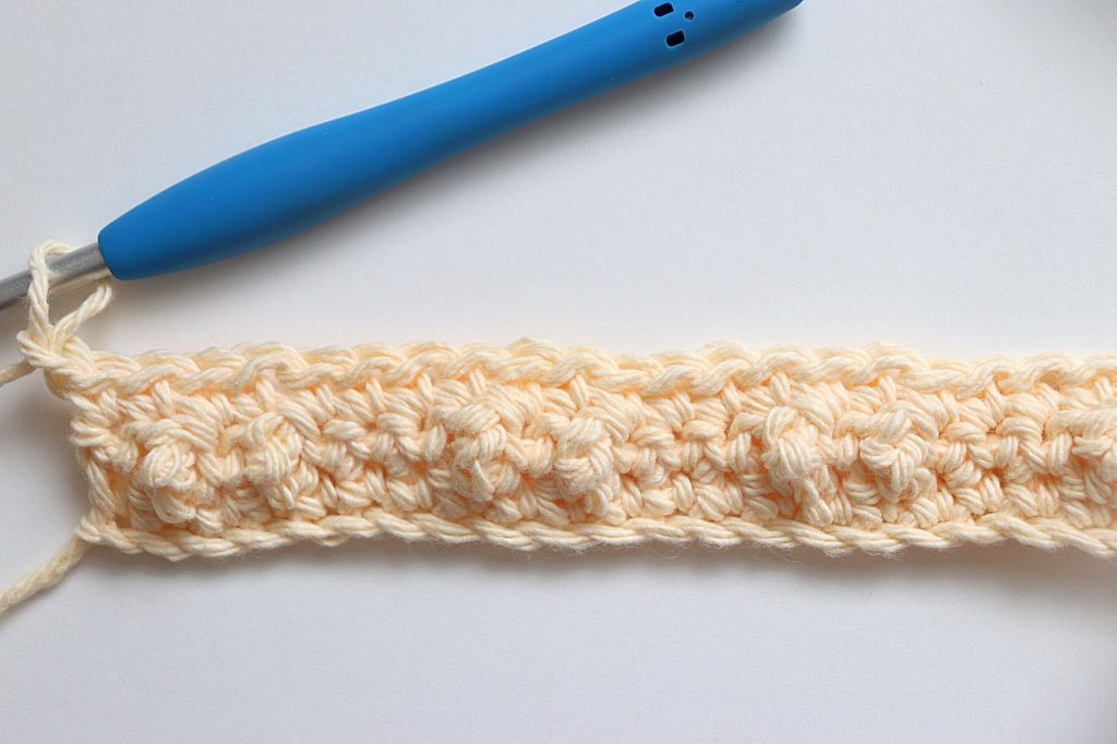 After Row 3 is completed of the Treble Pop Washcloth Crochet Pattern - tutorial photo