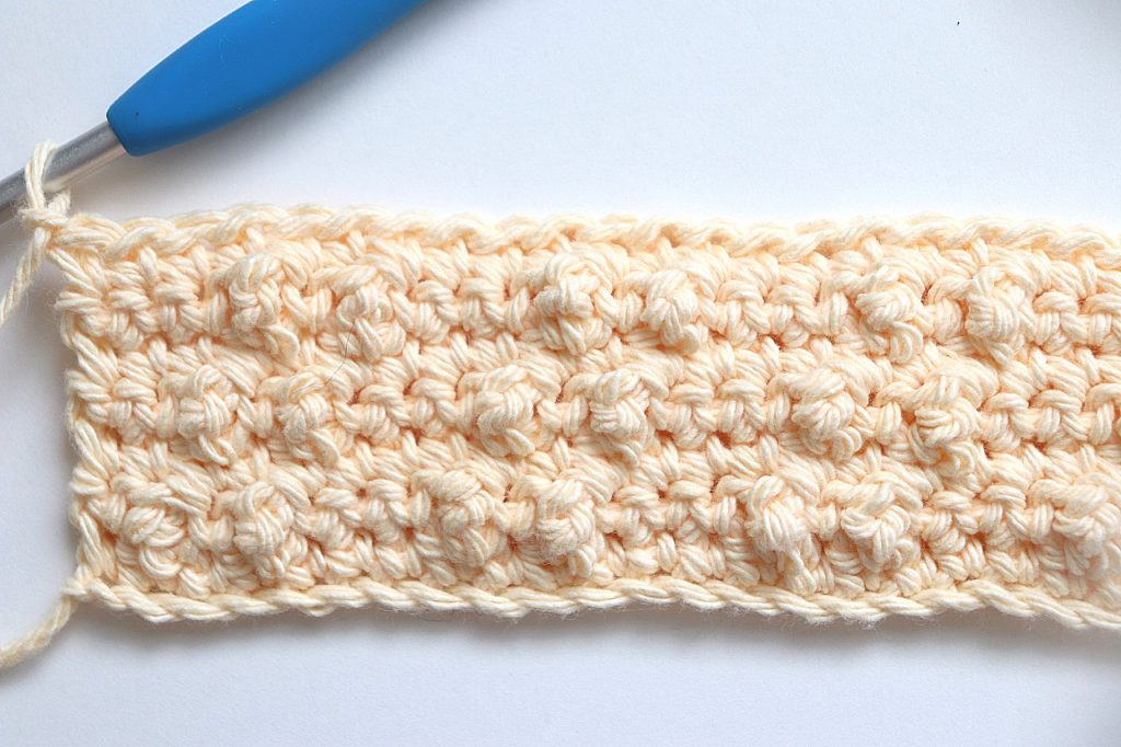 After Rows 6 and 7 are completed of the Treble Pop Washcloth Crochet Pattern - tutorial photo