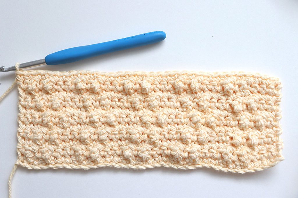 After Rows 10 & 11 are completed of the Treble Pop Washcloth Crochet Pattern - tutorial photo