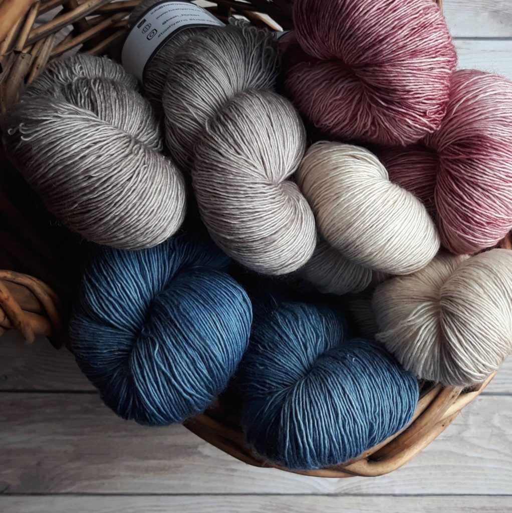 A photo of eight single ply yarn hanks - via Sigoni Macaroni's How to Choose the Right Yarn