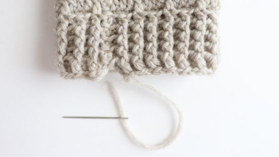 The ribbed cuff that lines the top and bottom of the slouchy crochet leg warmers. Use a tapestry needle to sew the beginning foundation row together.