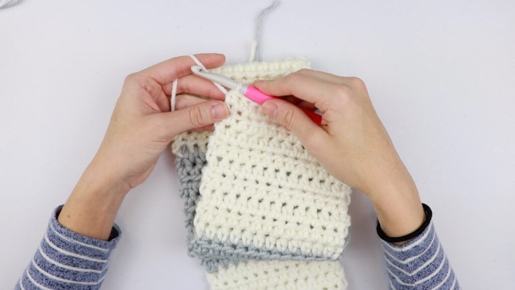 Screenshot from the Cheaters Gingham Blanket CAL Part 1 video tutorial showing Sigoni working on the first panel of the crochet along.