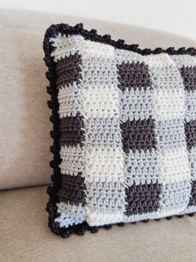 gingham crochet pillow cover using traditional colors (black, grey, white)