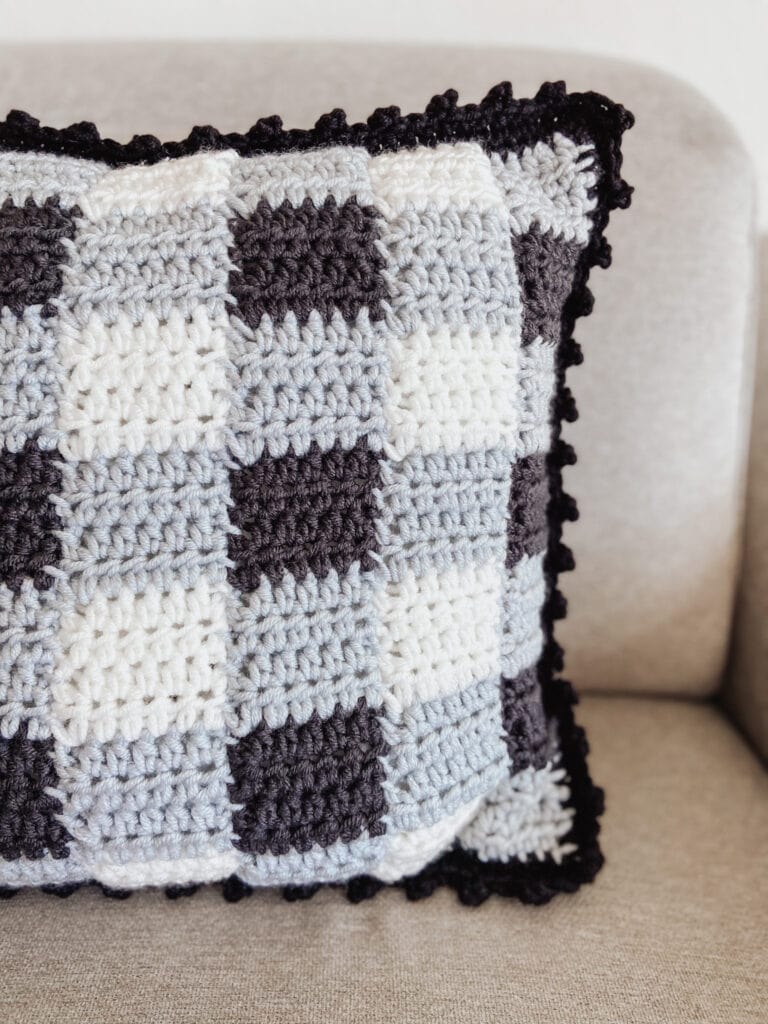 Gingham Style Crochet Pillow Cover using traditional gingham colors (white grey black) and a bobble edge