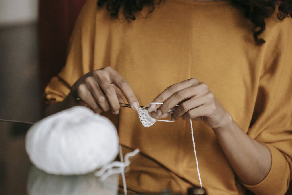 A Person Crocheting 